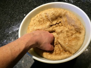 Punching down the dough.
